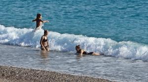 Tourists exempted from the restriction enjoyed the sea and the sun